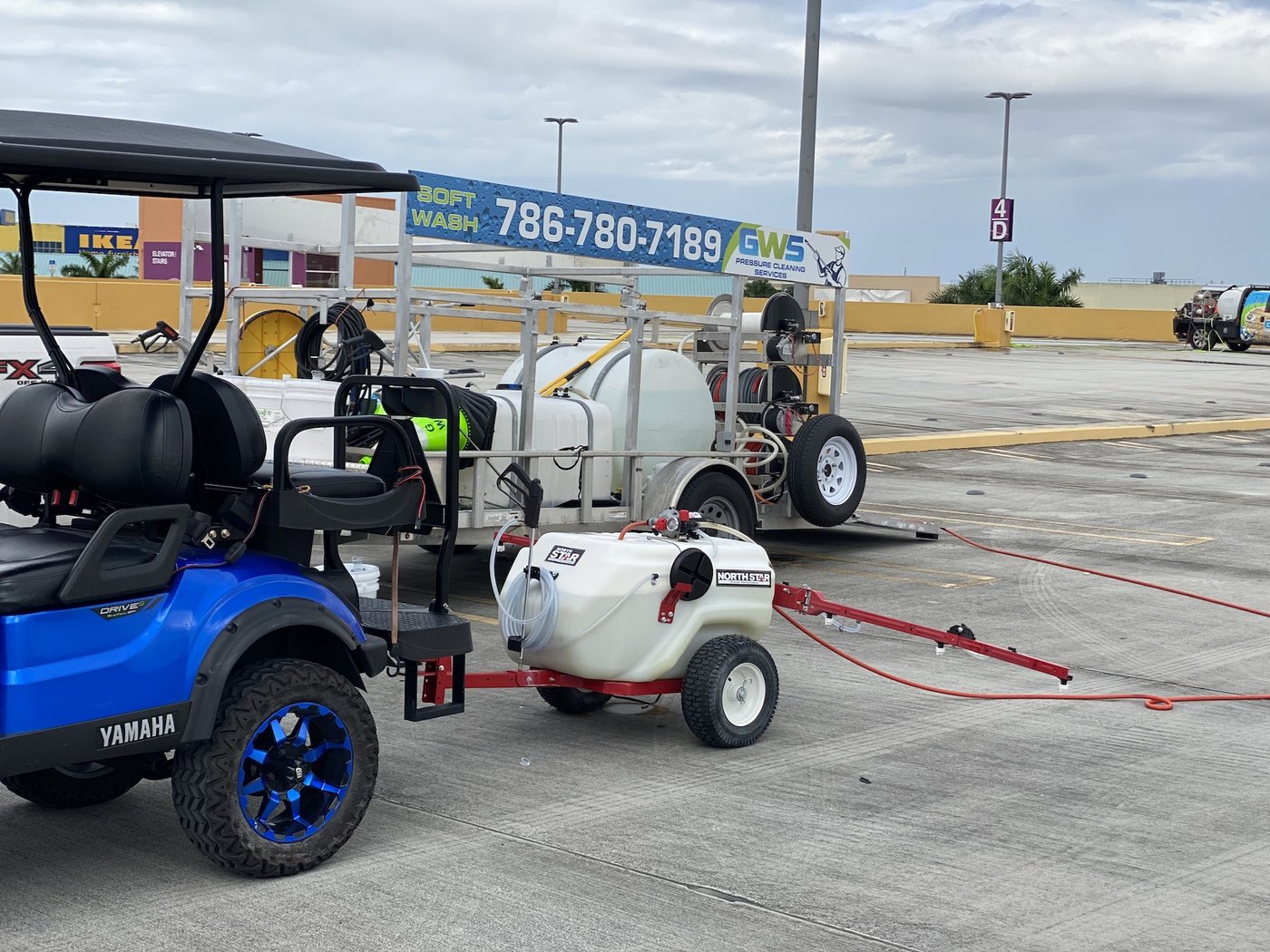 GWS pressure-washing rig and equipment carts on a job site